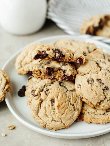 A close up look at Magnolia Table Chocolate Chip Cookies showing an ooey gooey chocolate chip center.