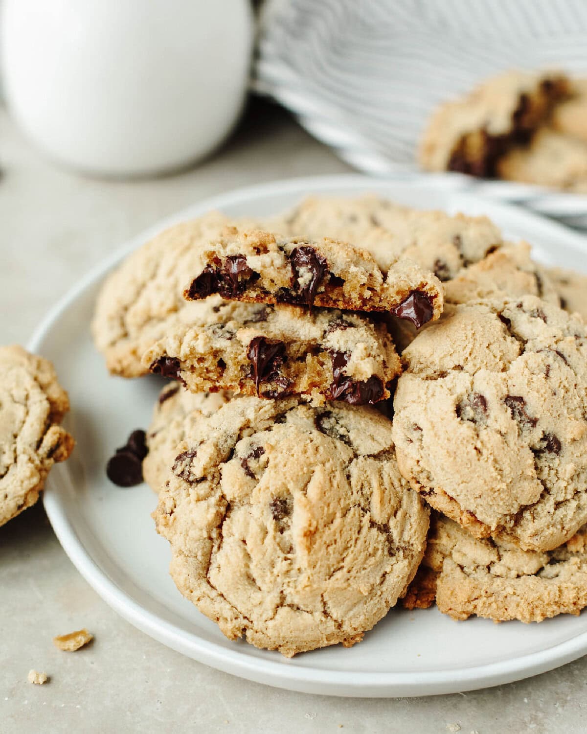 A close up look at Magnolia Table Chocolate Chip Cookies showing an ooey gooey chocolate chip center.