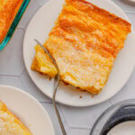 A top look at a slice of butter cake sprinkled with powdered sugar.