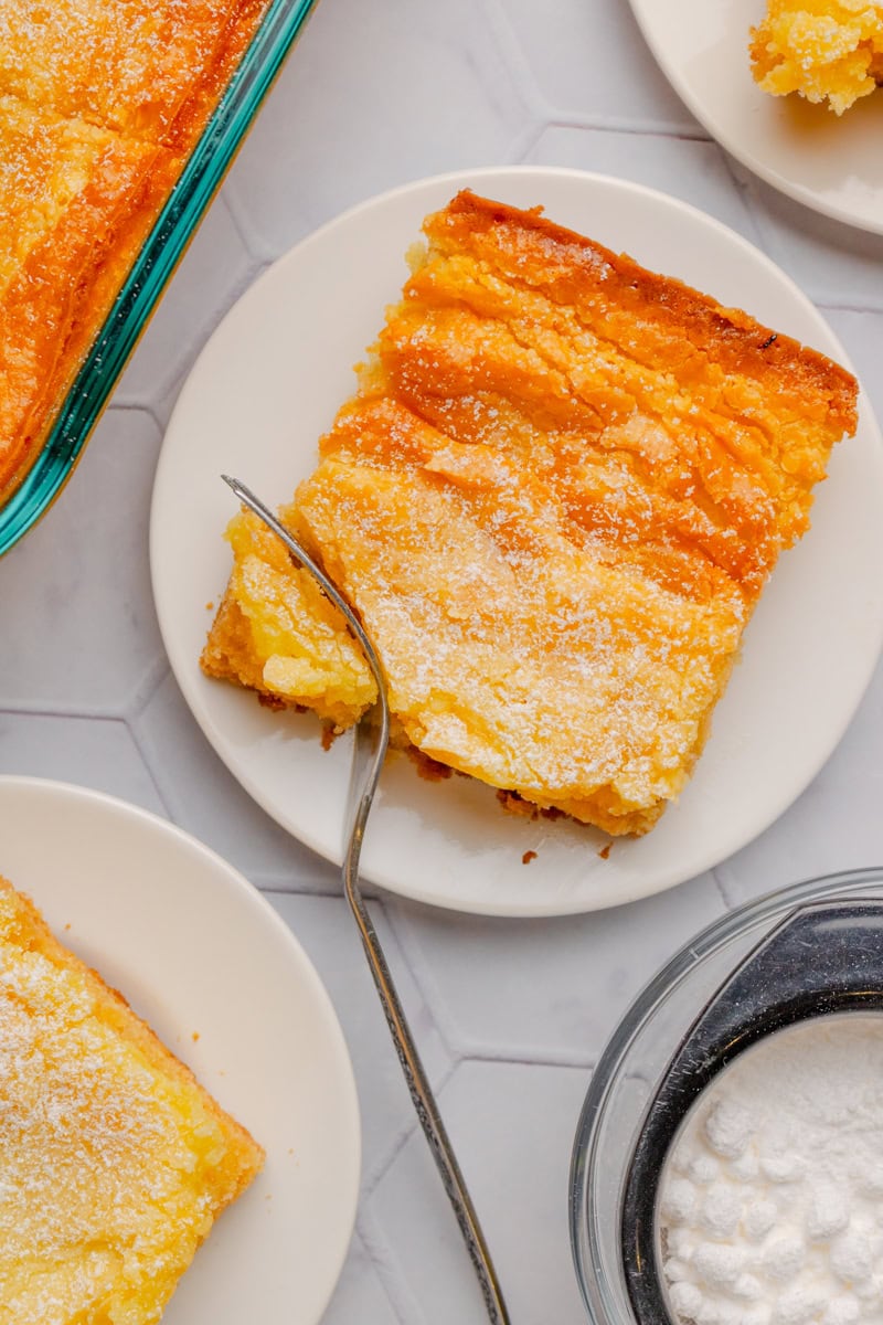 A top look at a slice of butter cake sprinkled with powdered sugar.