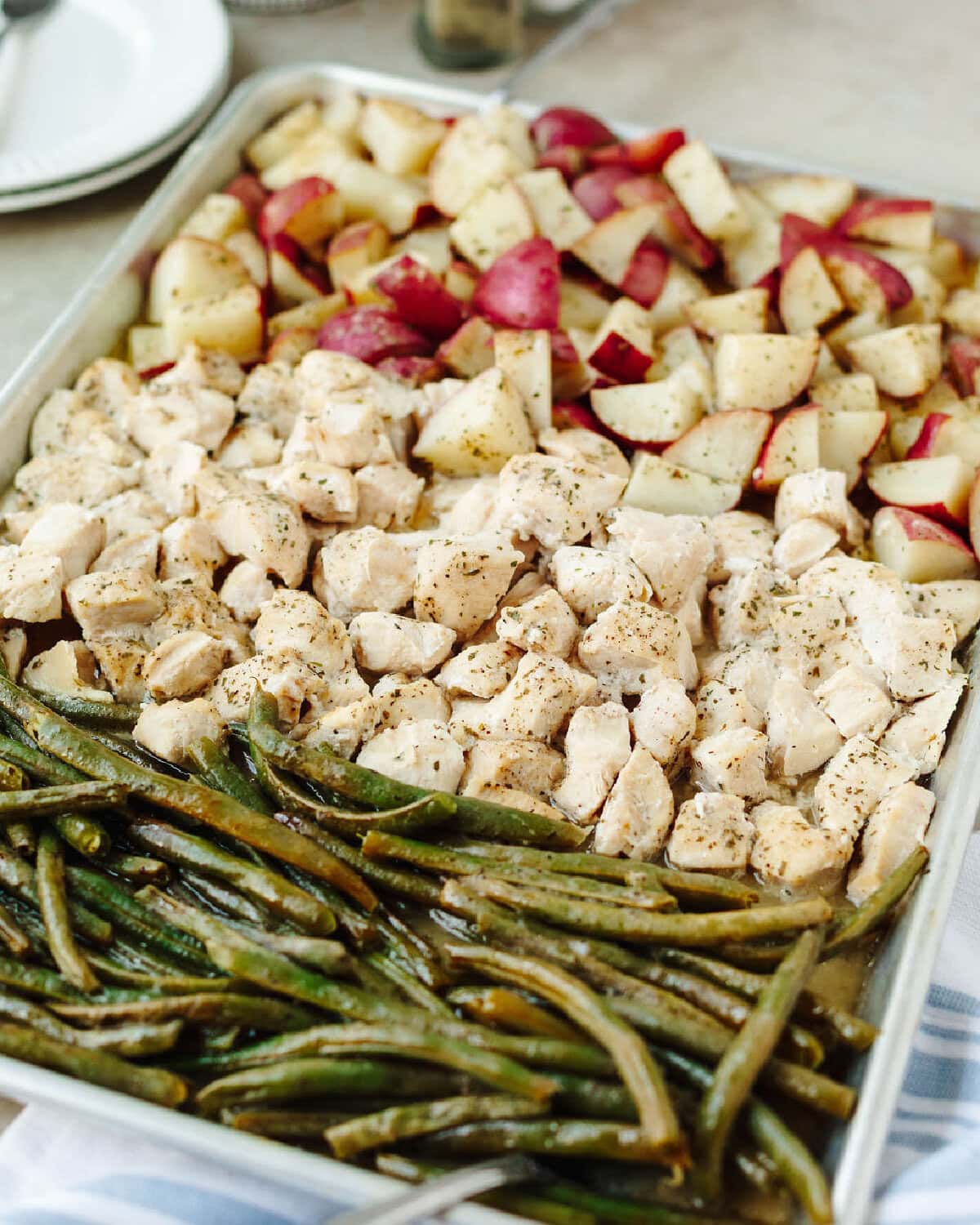Baked sheet pan Ranch chicken with potatoes and green beans.