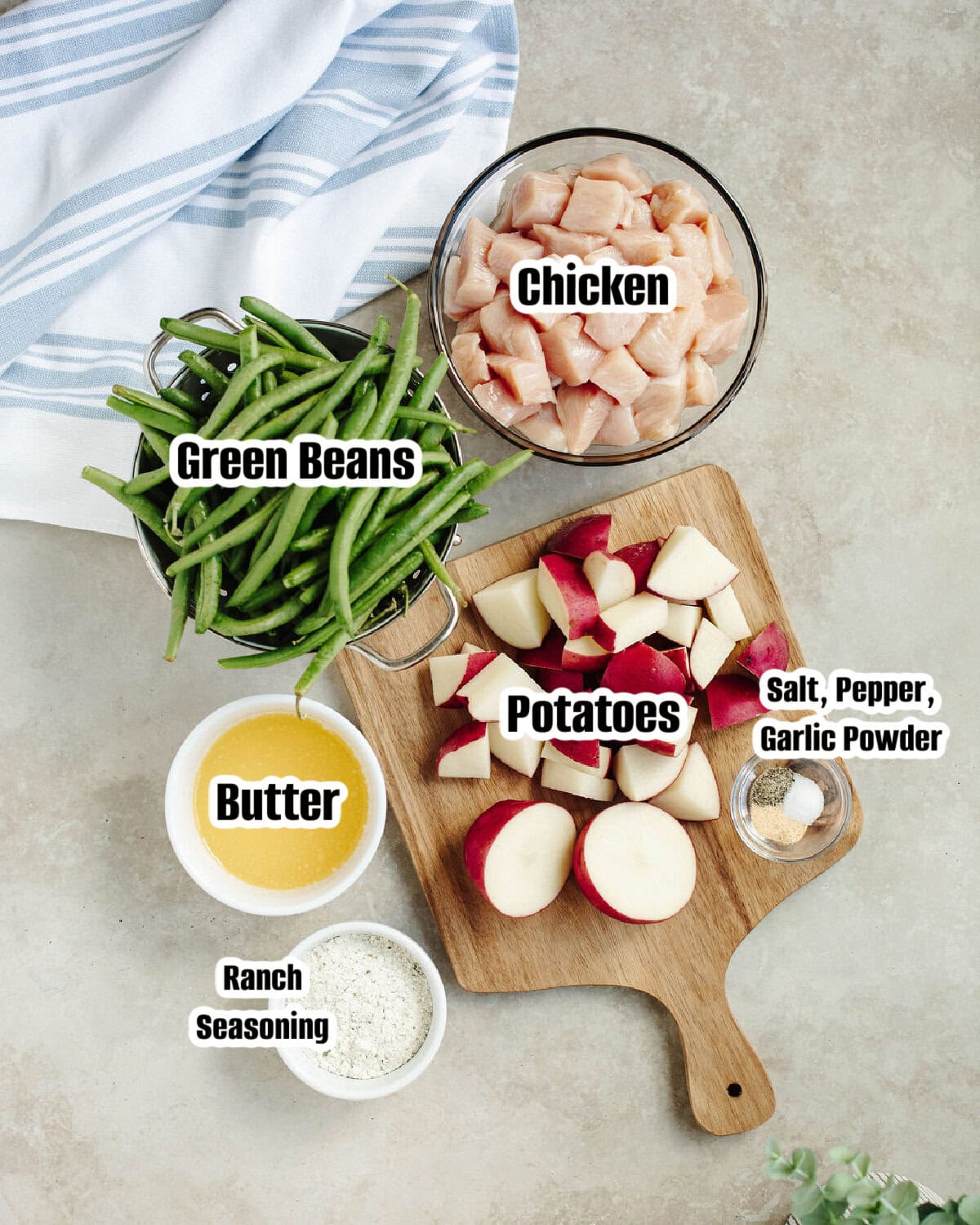 All the ingredients needed to make Ranch chicken potatoes and green beans.