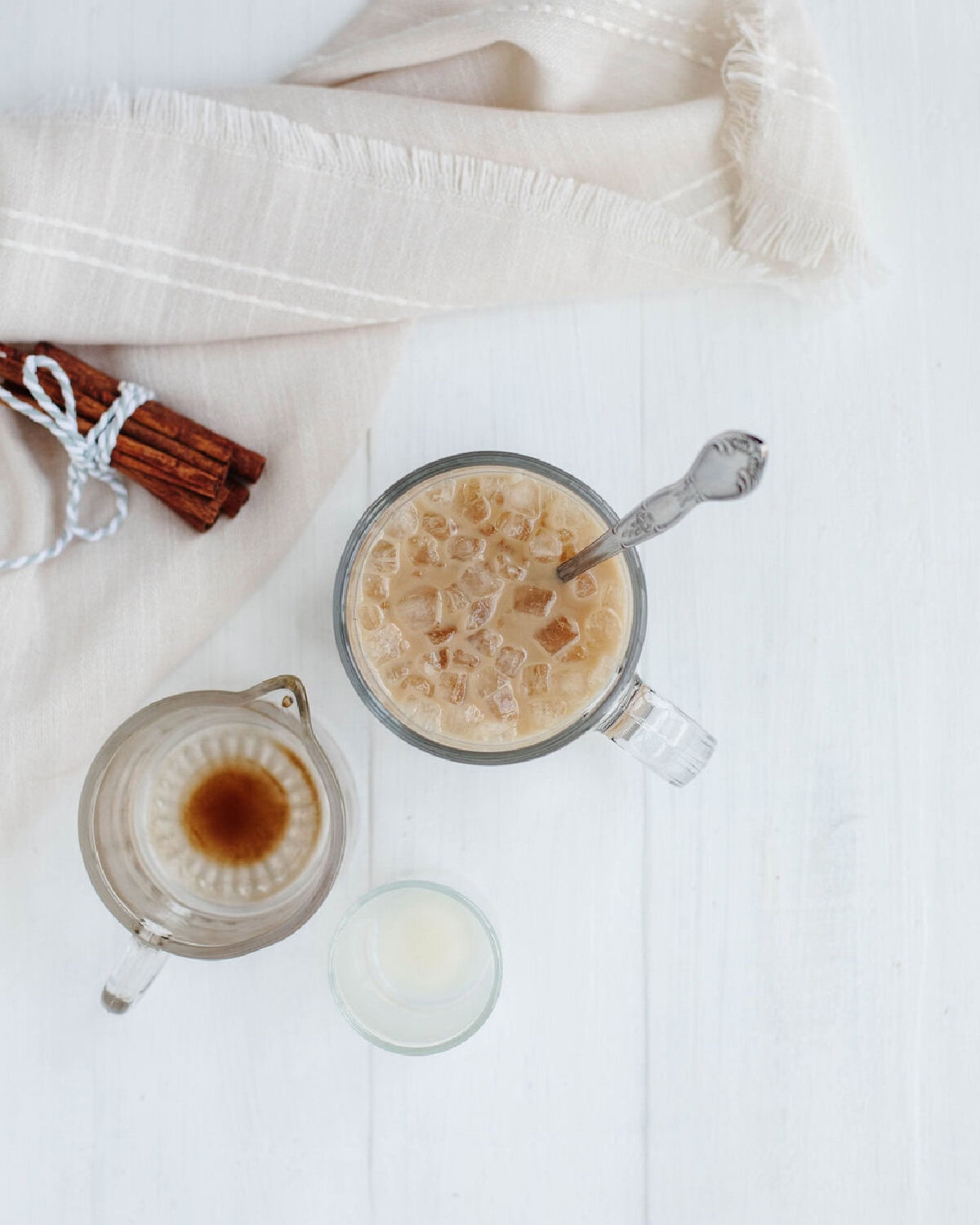 A top view of a glass filled with ice, coffee, and RumChata.