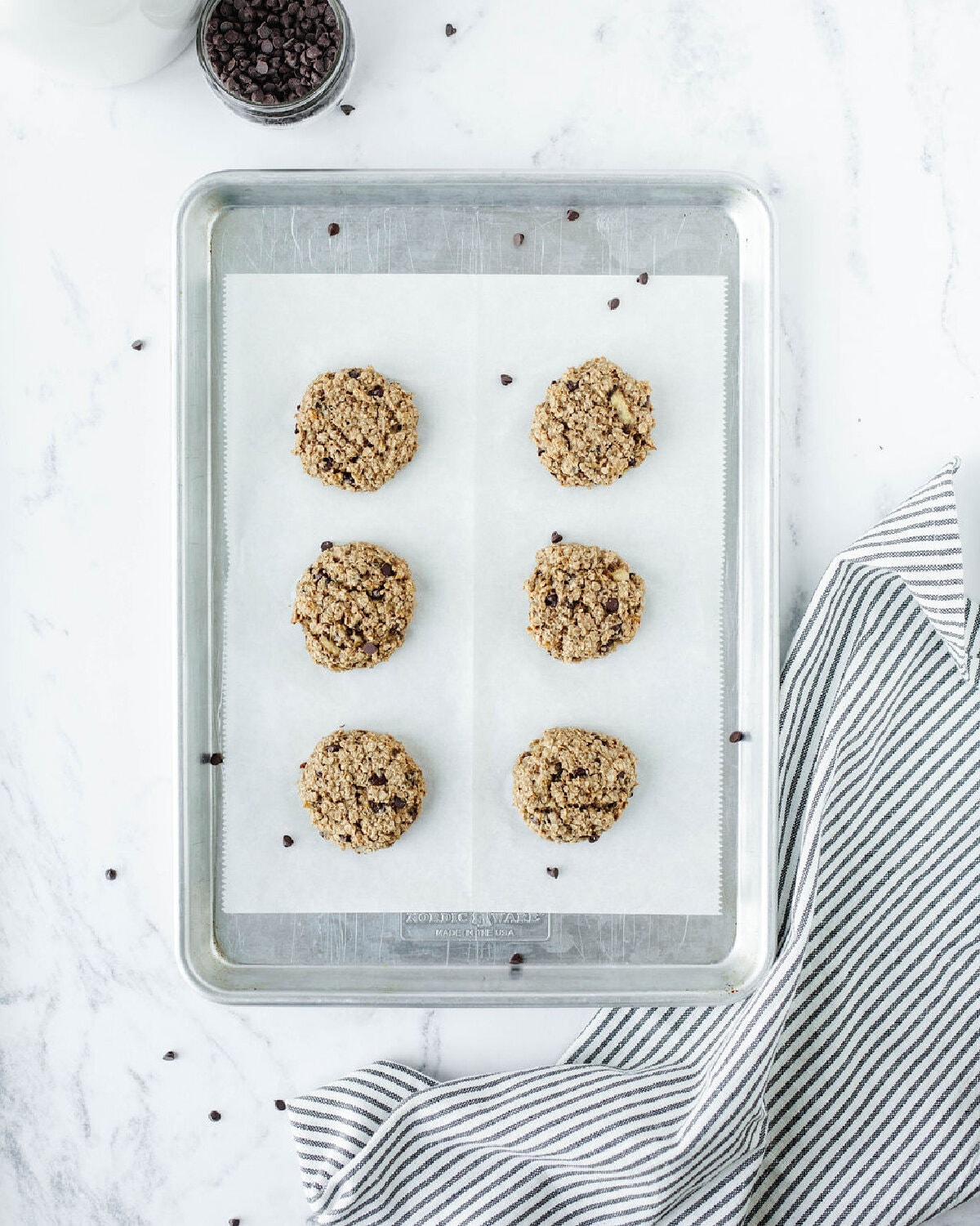 Baked banana oat peanut butter cookies on a cookie sheet.