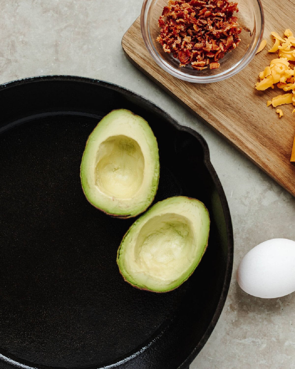 Sliced avocado in a cast iron skillet.
