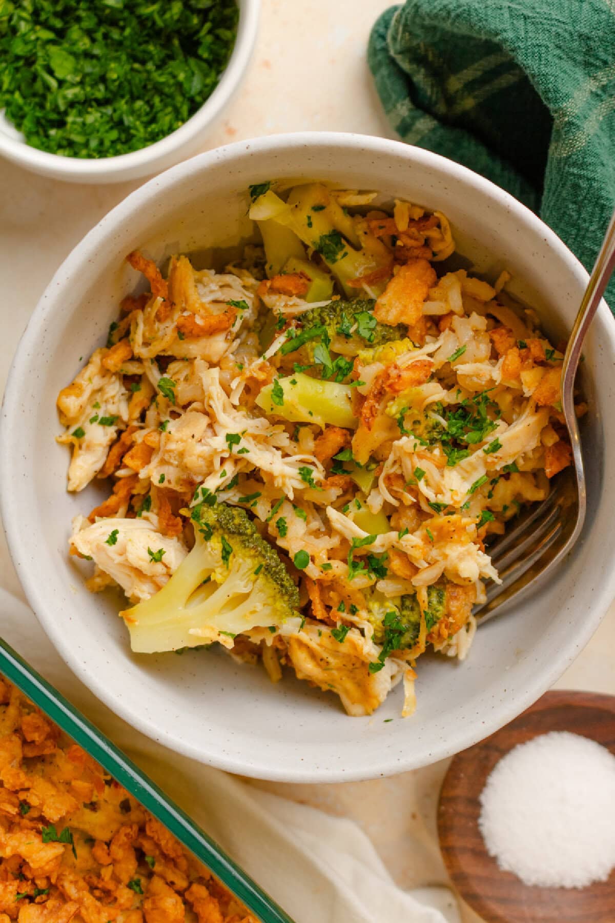 A serving of chicken broccoli casserole in a bowl served with a fork.