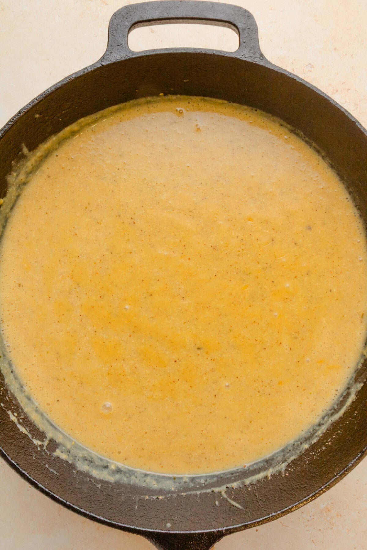 Cream of chicken soup mixture in a black pot.
