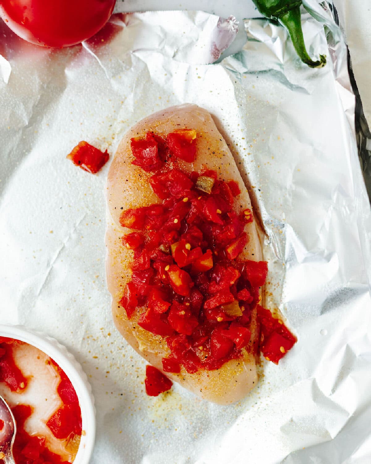 Rotel on top of a seasoned boneless chicken breast.