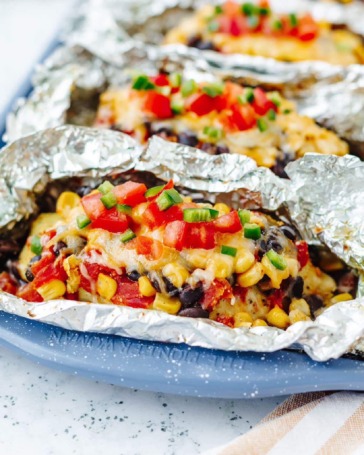 An up close look at chicken foil packets ready to serve.