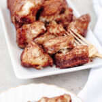 Cinnamon sugar pull apart bread on a white serving platter.