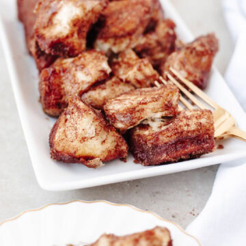 Cinnamon sugar pull apart bread on a white serving platter.