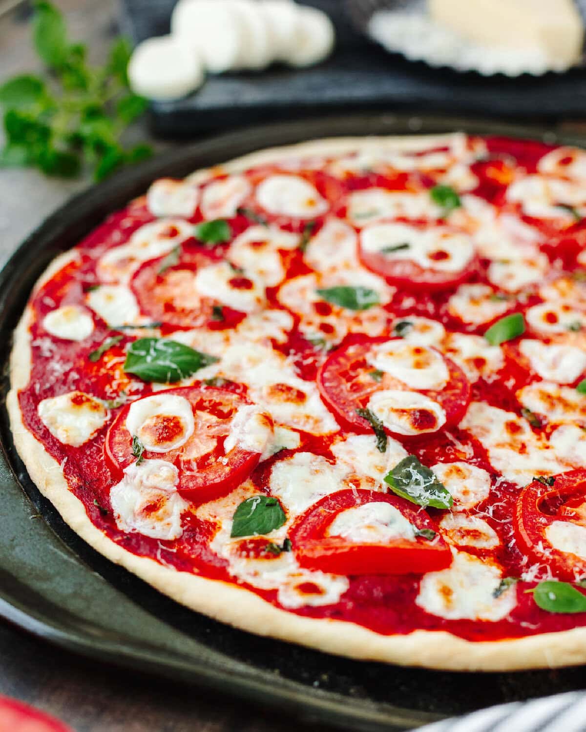 no yeast pizza dough baked in a cast iron pan with toppings.