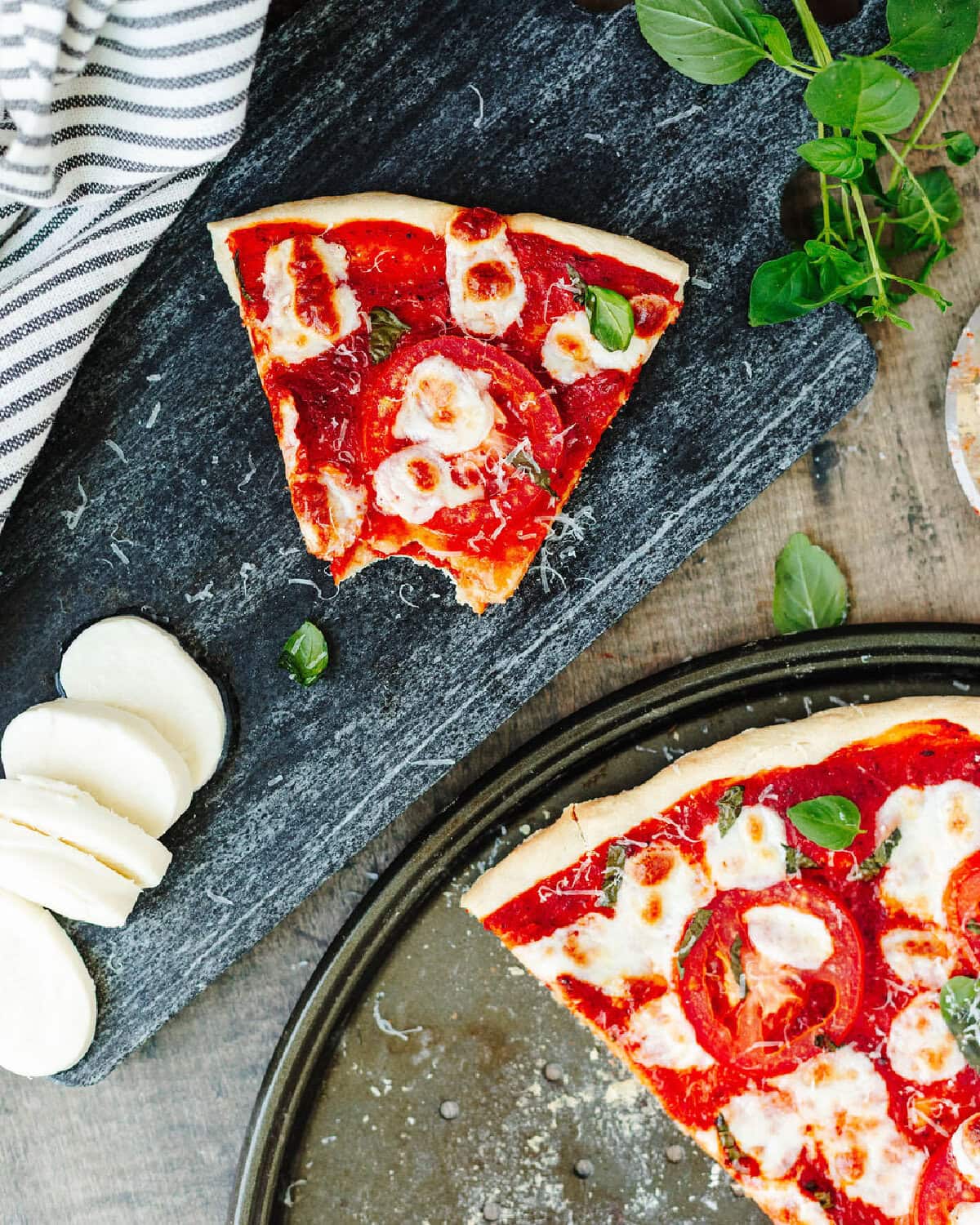 Sliced pizza on a serving platter.