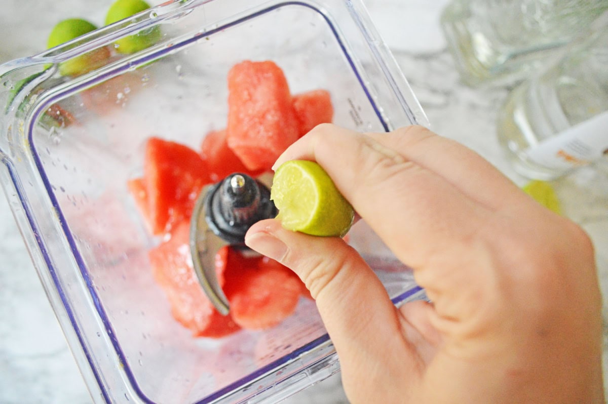 A lime wedge squeezed into a blender pitcher.