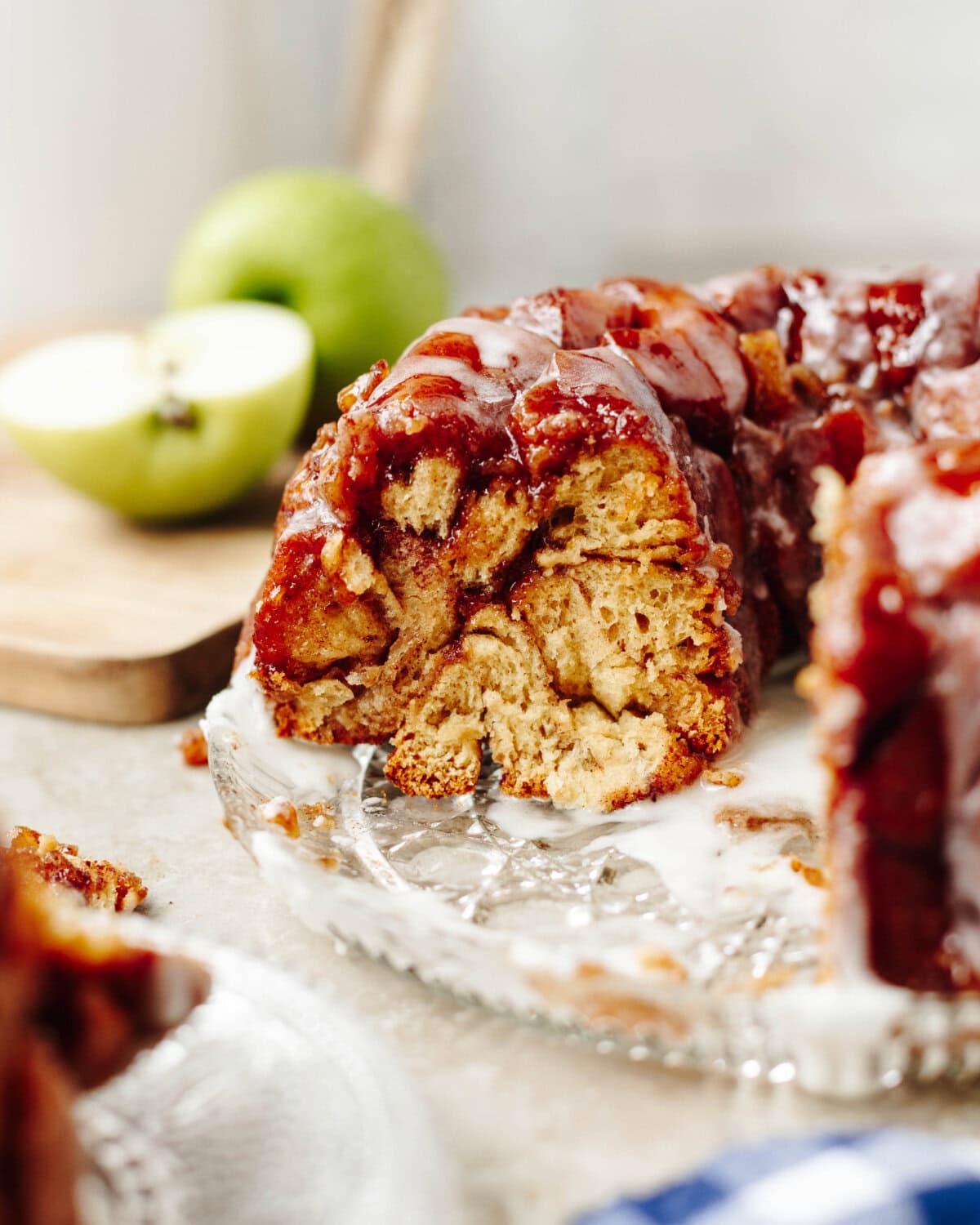 Apple Cinnamon Monkey Bread drizzled with sweet glaze on a serving platter