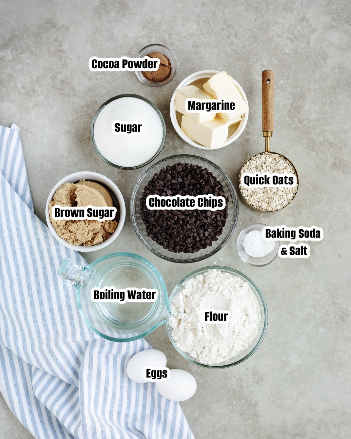 All the ingredients needed to make a Chocolate Oatmeal Cake from scratch.