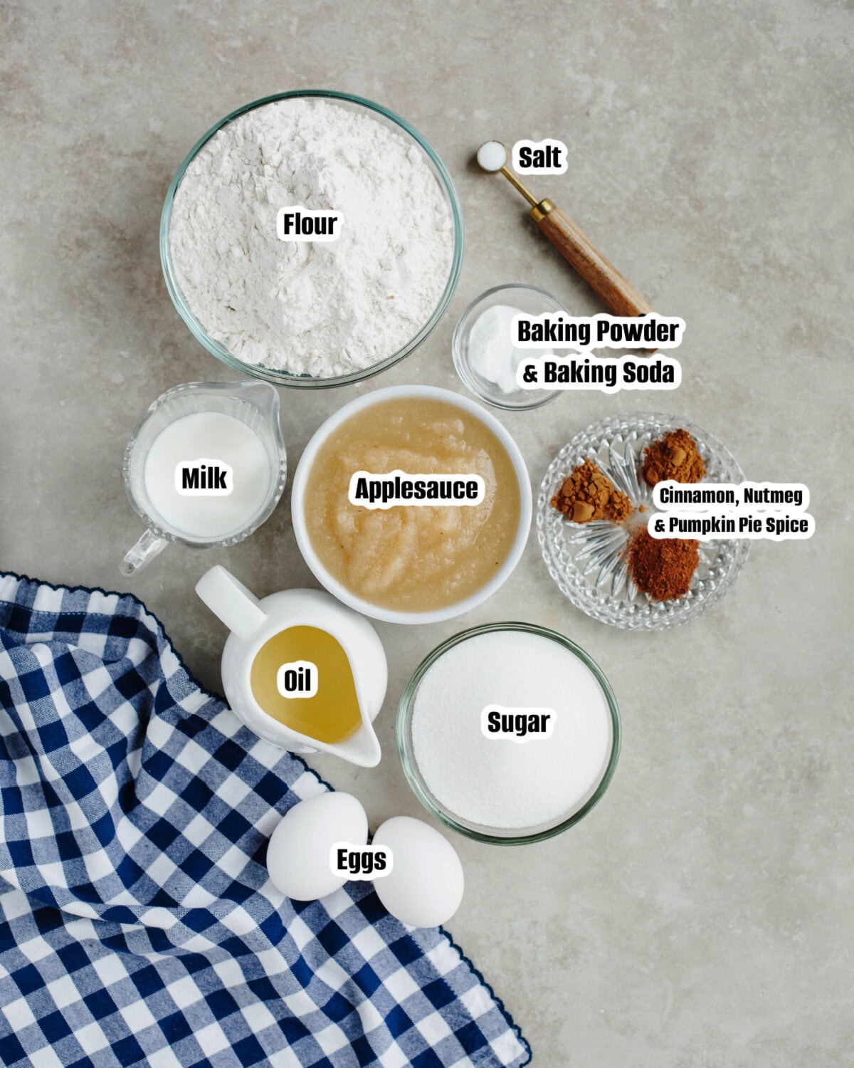 All the ingredients needed to make cinnamon applesauce bread from scratch.