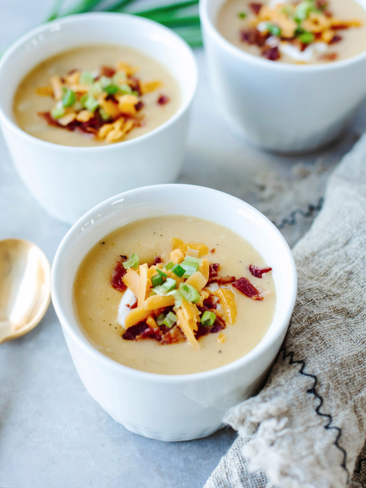 Instant pot potato soup in a white bowl.