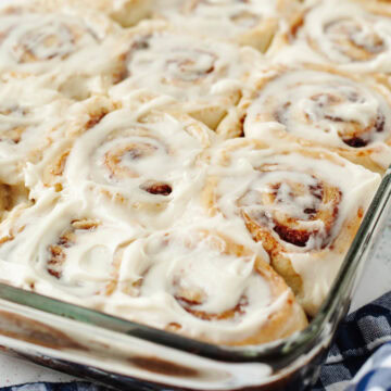 A glass baking pan with homemade cinnamon rolls.