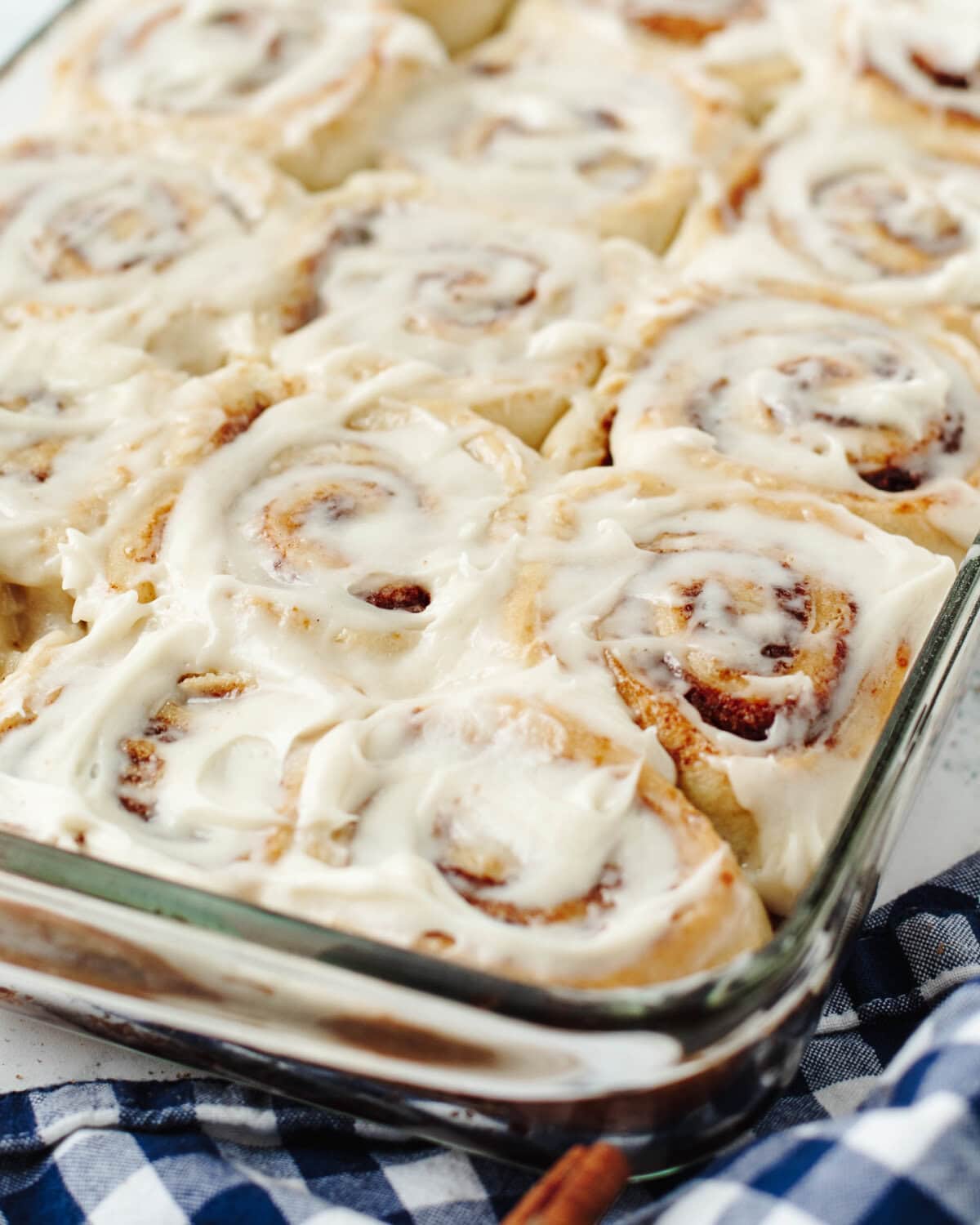 A glass baking pan with homemade cinnamon rolls.