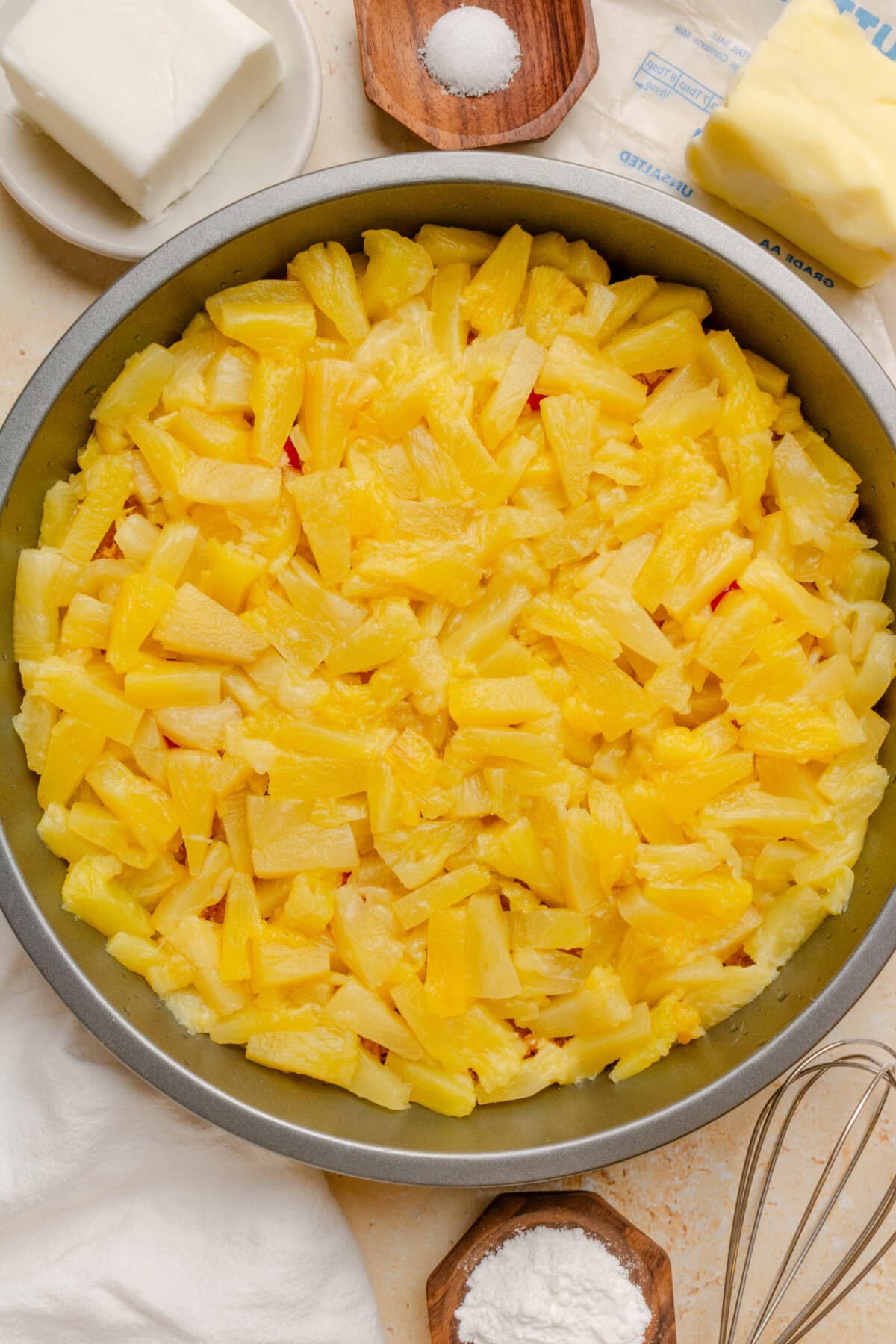 Pineapple tidbits arranged evenly over the brown sugar topping.