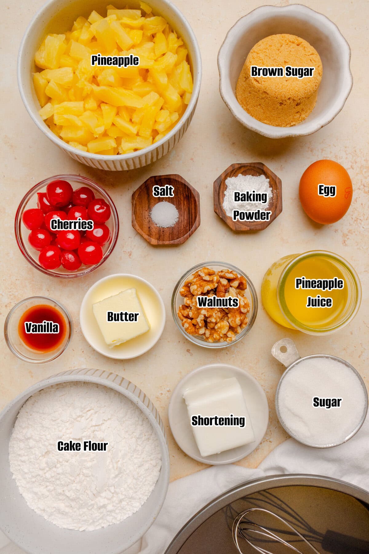 Ingredients needed to make Pineapple Upside Down Cake, including cake flour, pineapple, walnuts, brown sugar, and maraschino cherries.