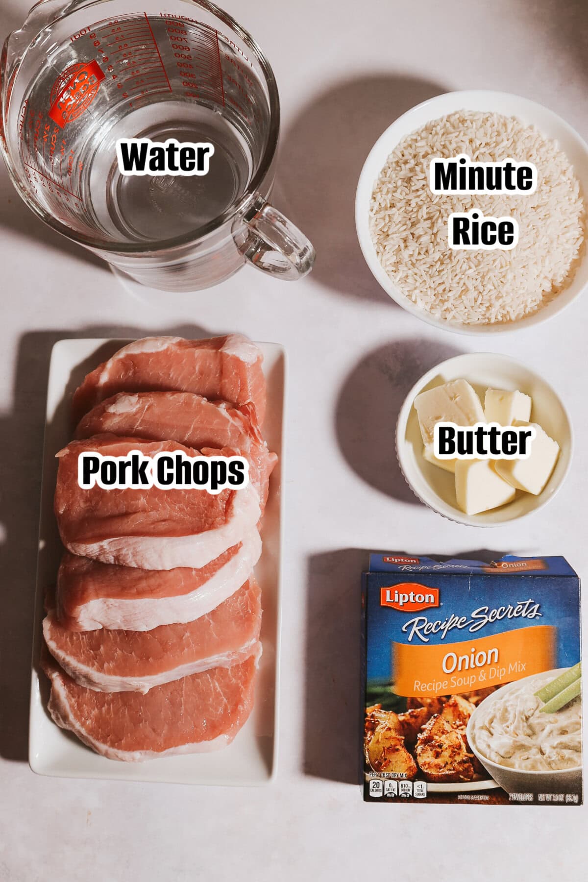 All the ingredients needed to make pork chop and rice casserole.