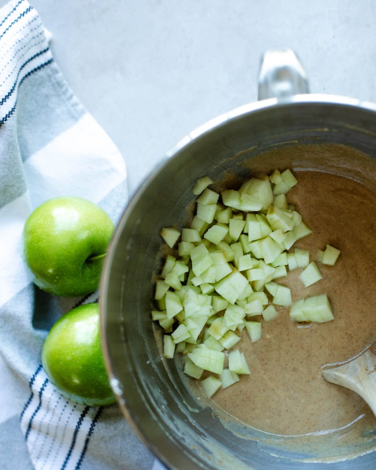 Chopped apples folded into bread batter.