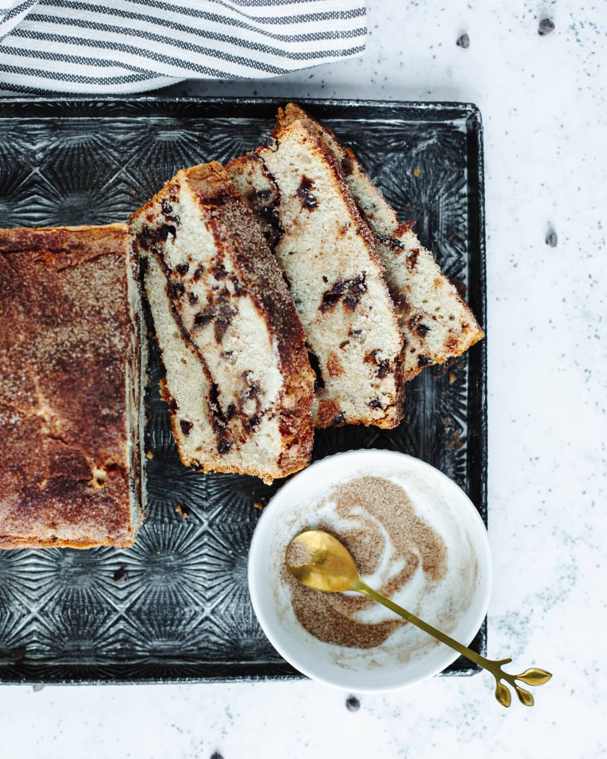 Sliced snickerdoodle bread on a cutting board.