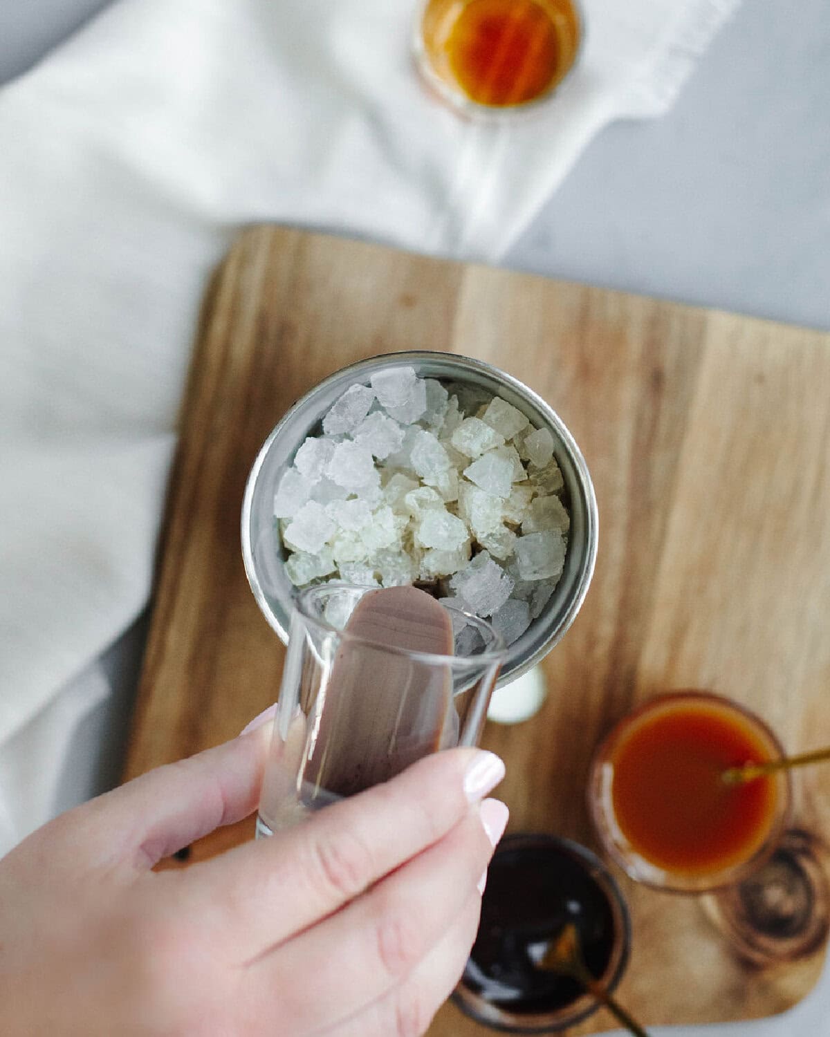 Chocolate liqueur added to a cocktail shaker.