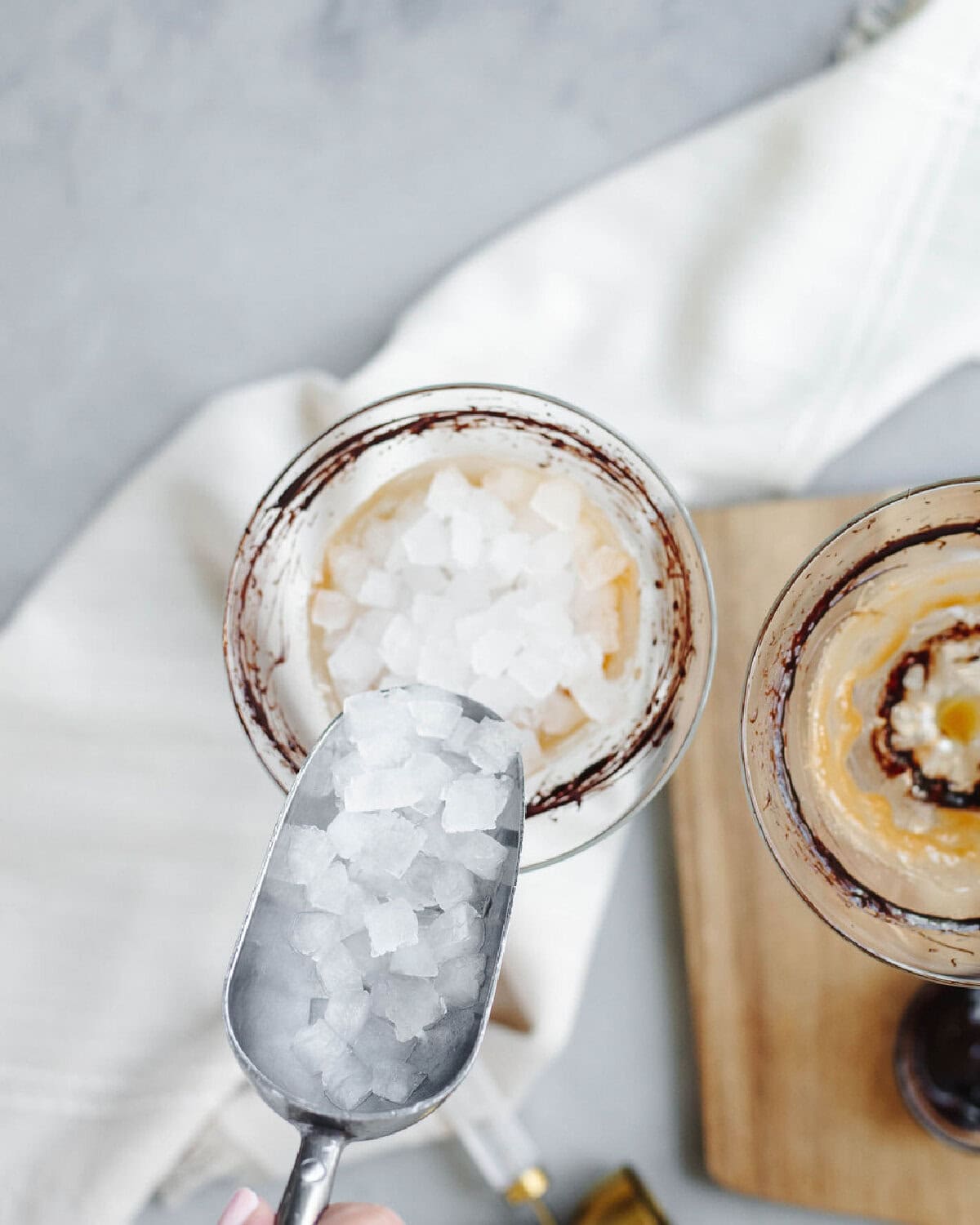 Fresh ice added to a martini glass.