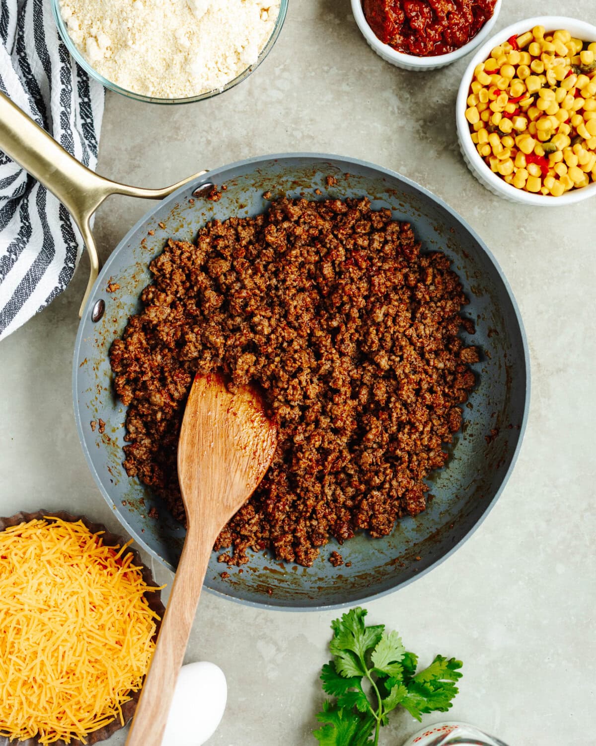 Ground beef cooked with taco seasoning in a skillet.