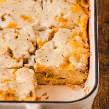 Biscuits and Gravy Breakfast Casserole baked in a white 9x13 baking pan and ready to serve.