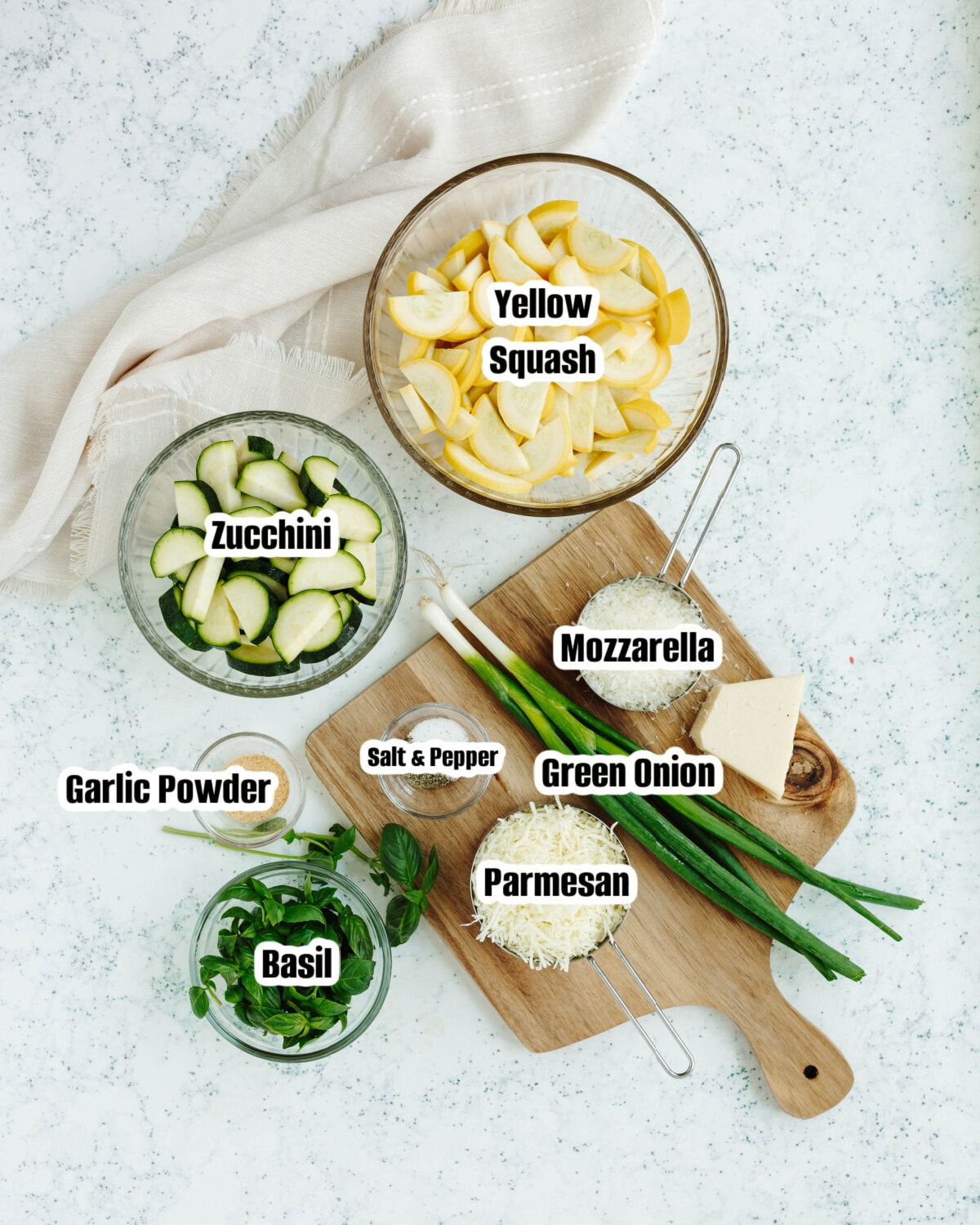 All the ingredients needed to make cheesy zucchini casserole.