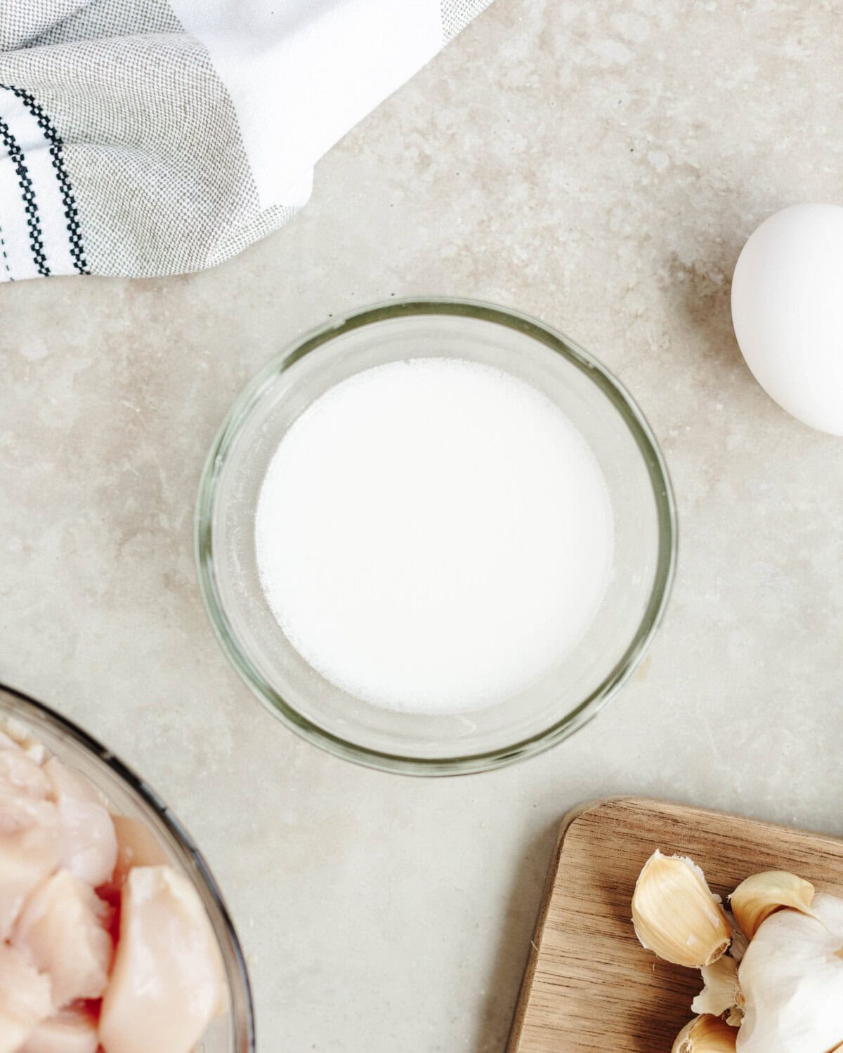 Cornstarch and water combined in a bowl to make a slurry.