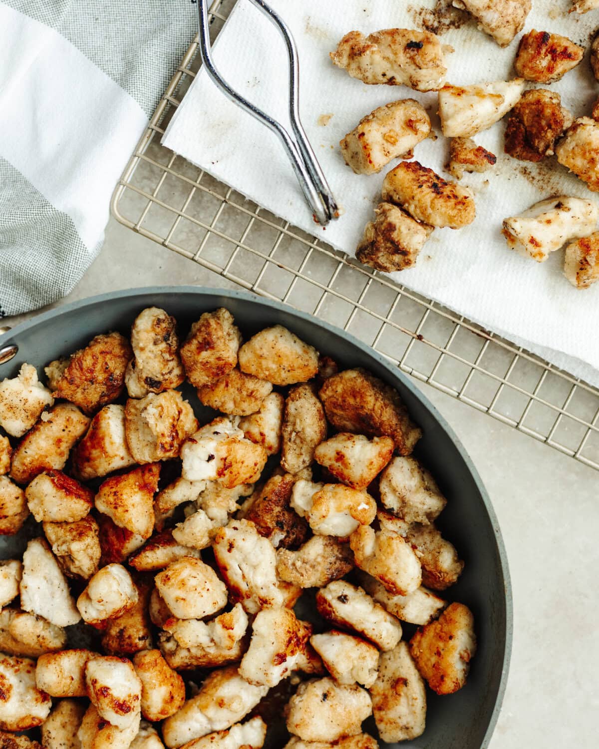 Diced chicken breast cooked in oil until crispy and cooked through.