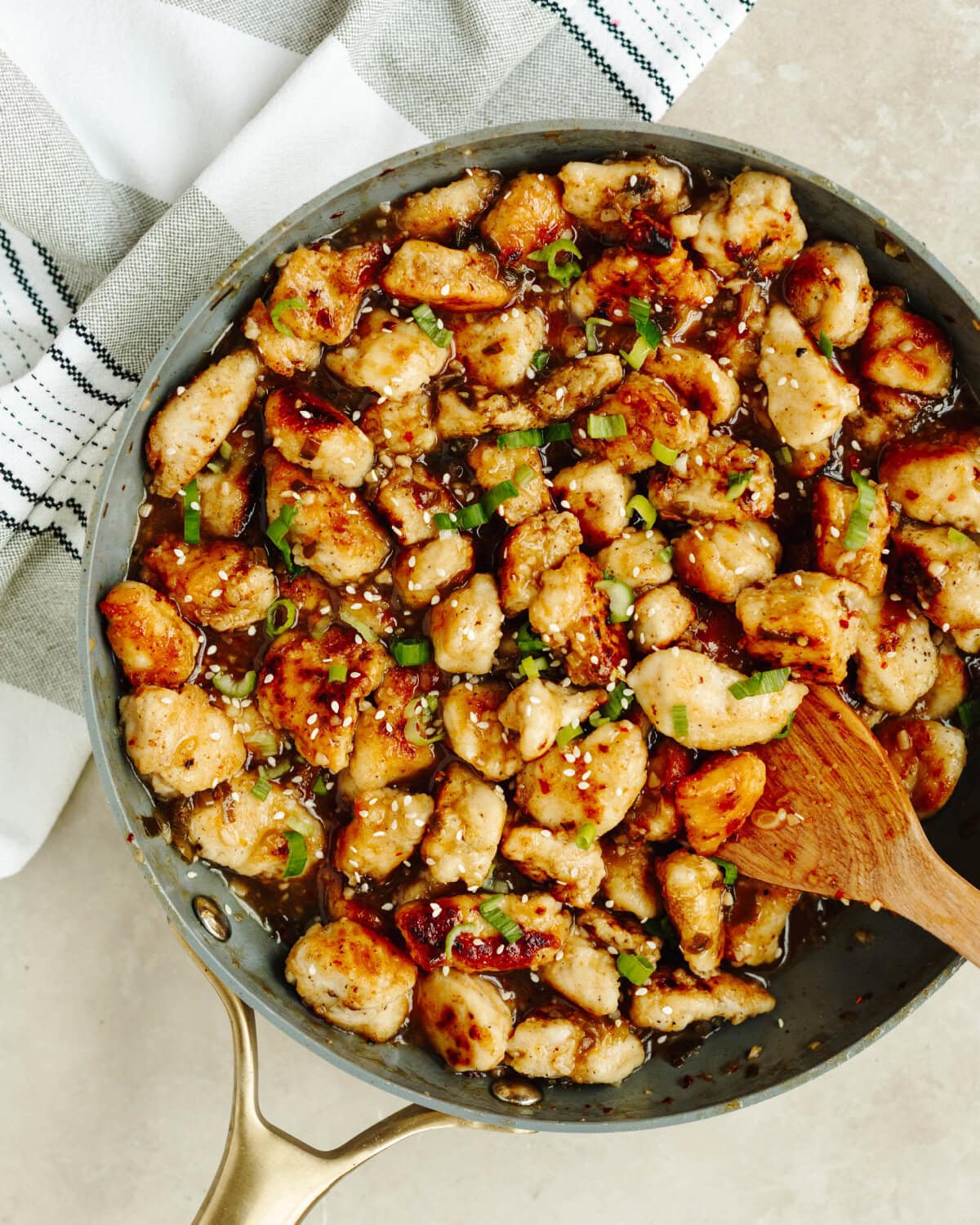 Orange chicken cooked and ready to serve from a skillet.