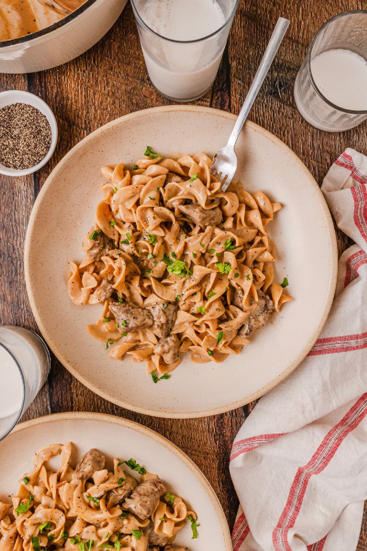 A dinner plate with beef and noodles ready to enjoy.