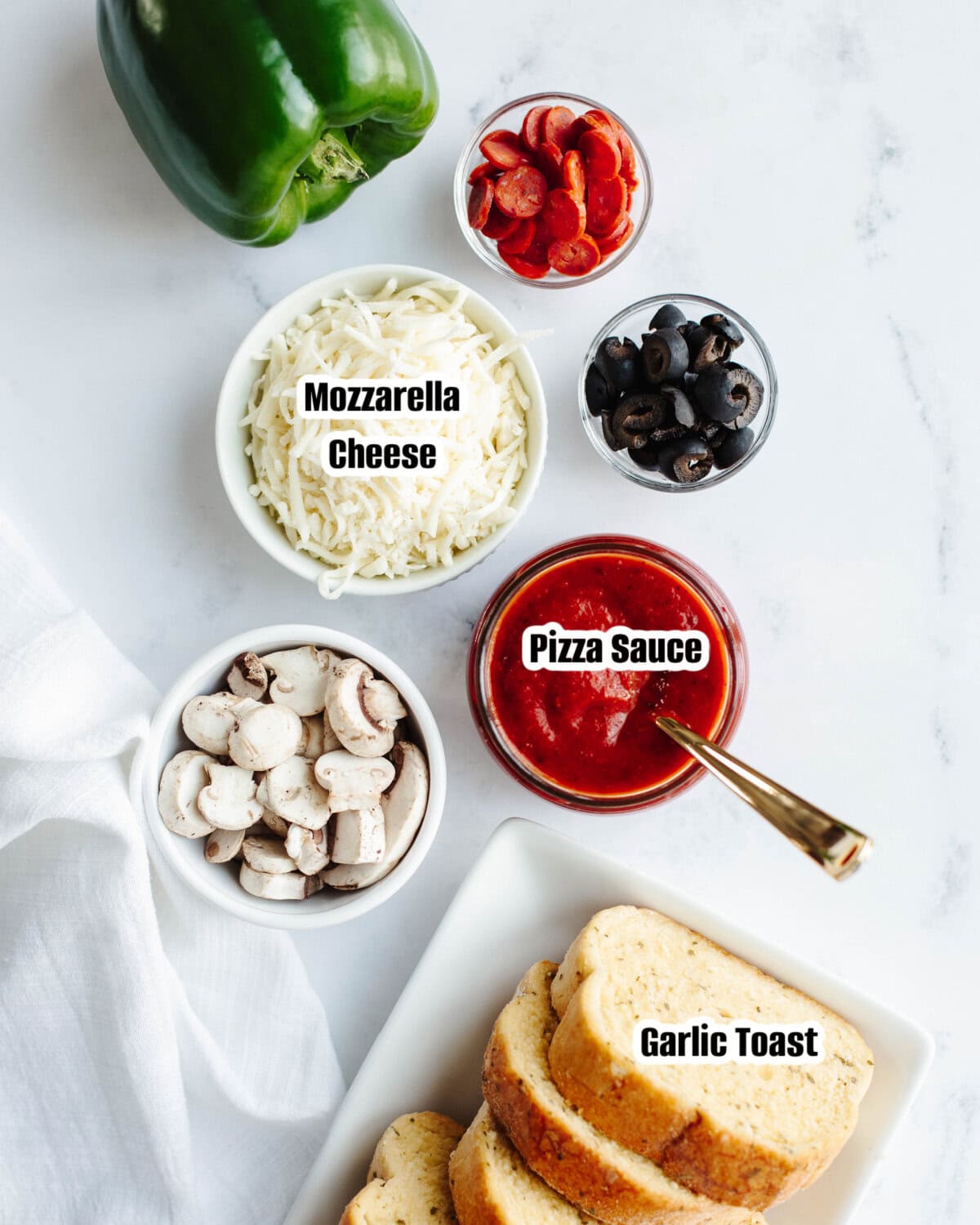 All the ingredients needed to make Garlic Bread Pizza.