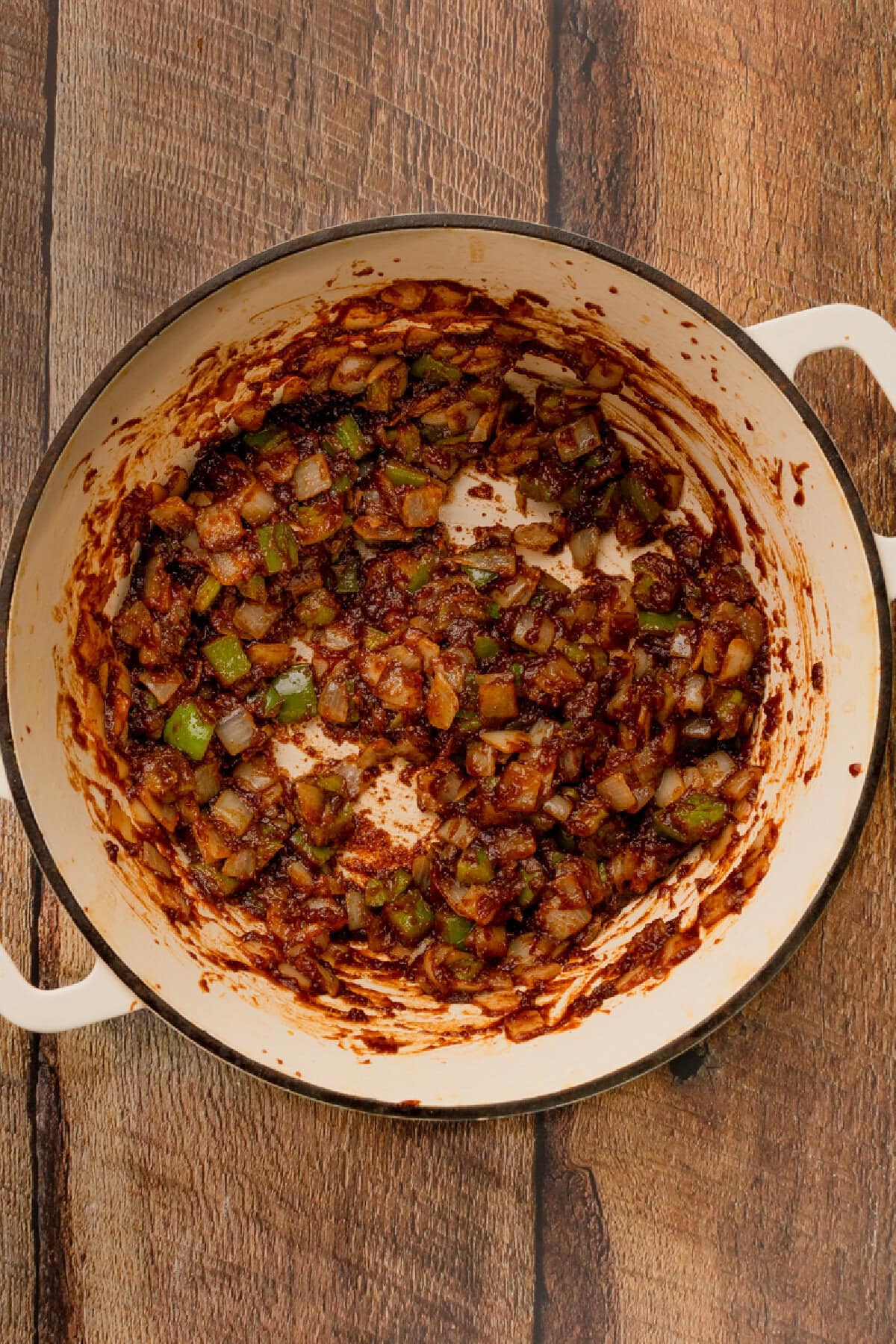 Onion and green peppers sauteed in a Dutch oven.