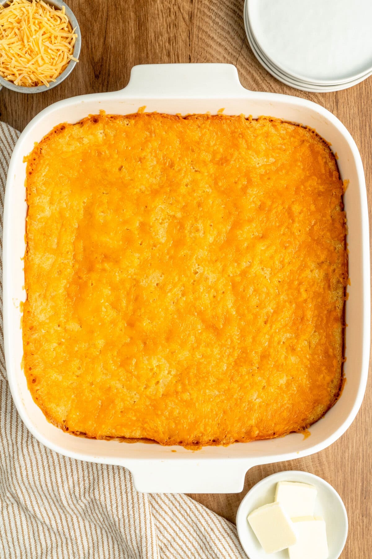 A white baking pan with jiffy cornbread casserole ready to serve.