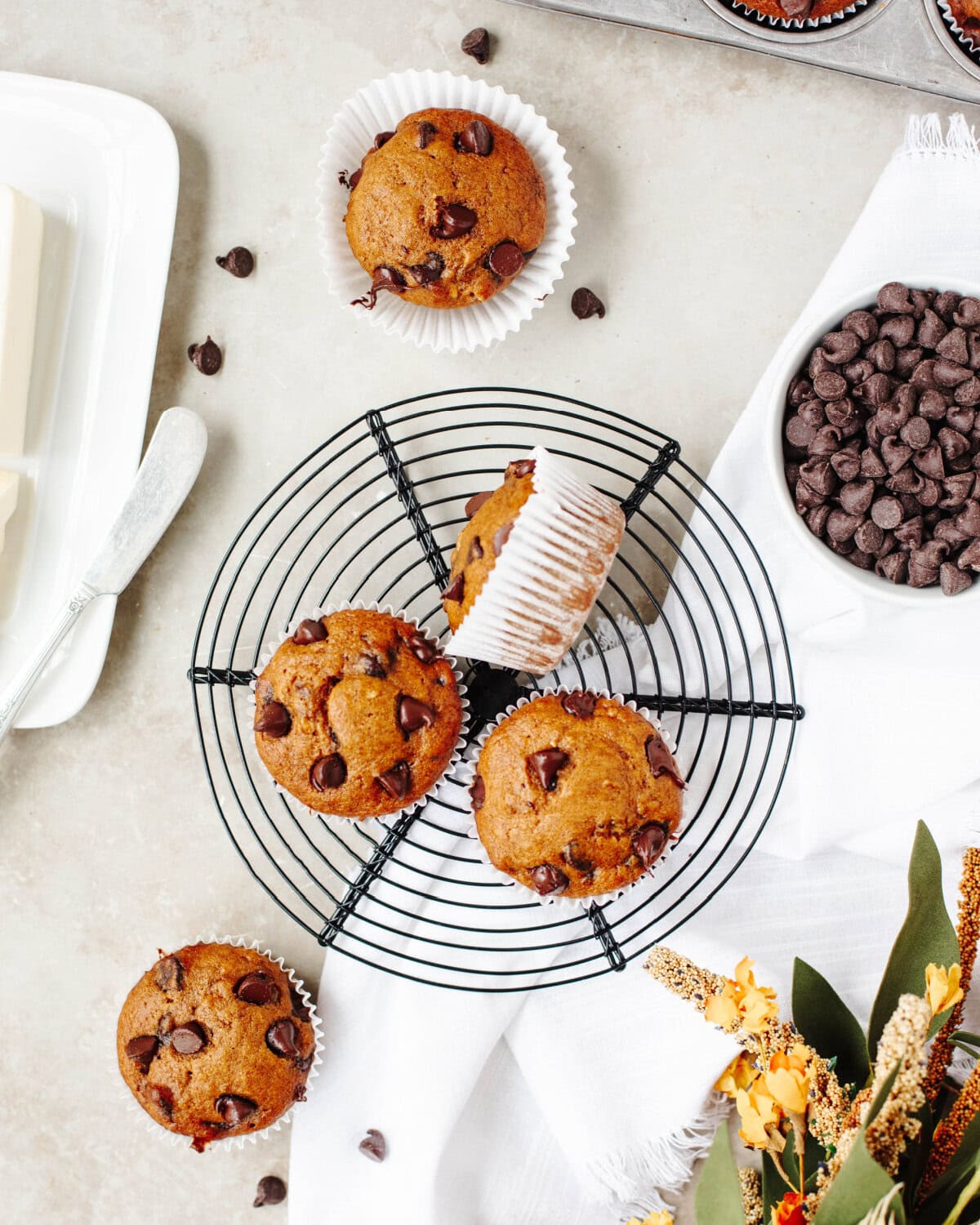 Baked Fall muffins cooling on a wire rack.