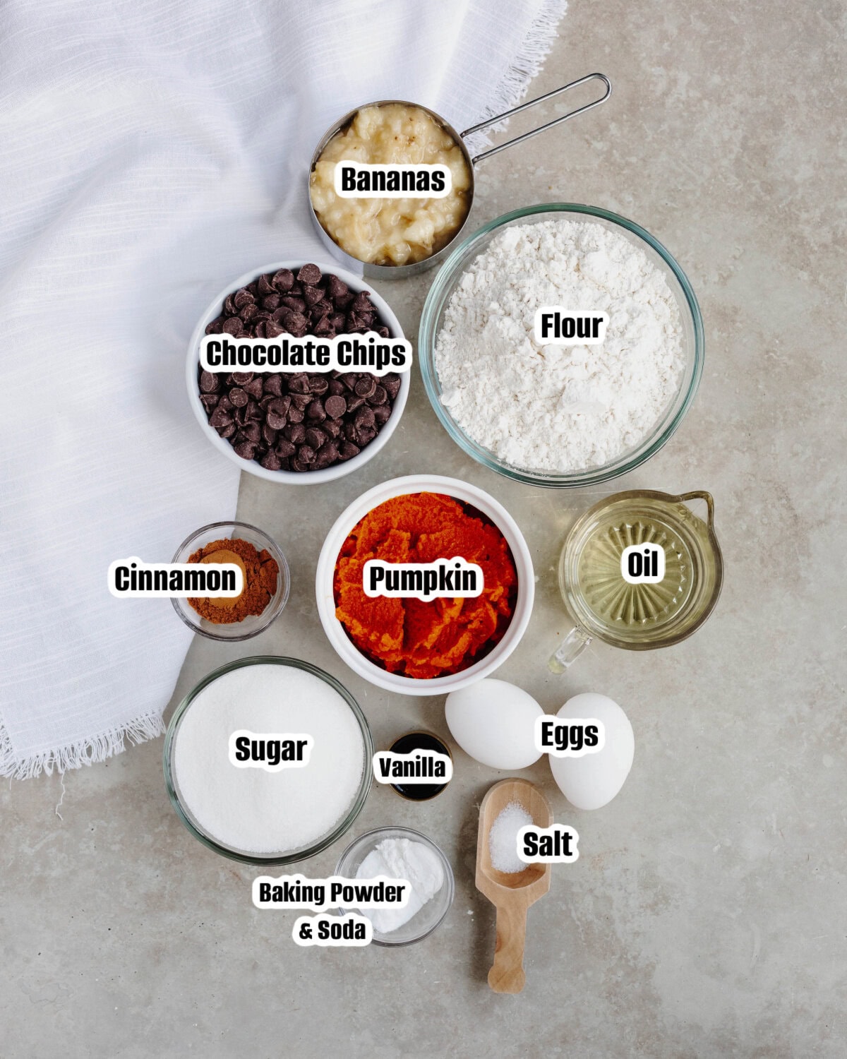 All the ingredients needed to make pumpkin banana chocolate chip muffins.