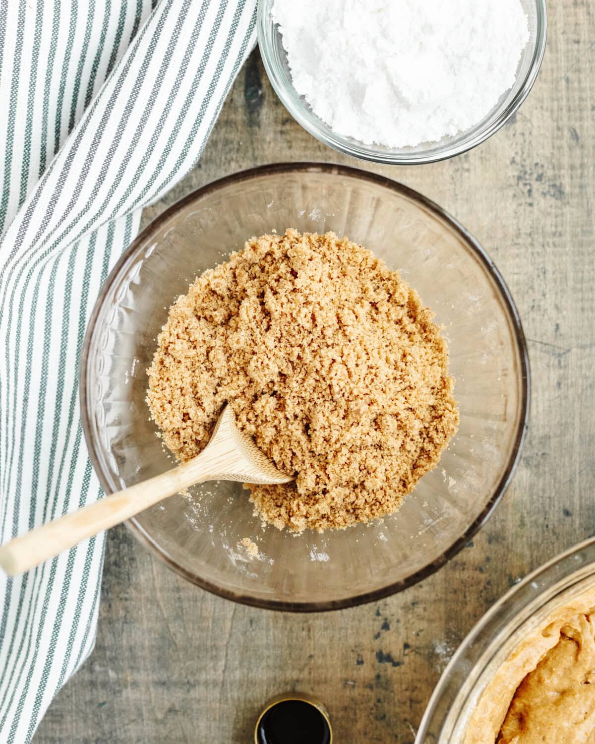 A cinnamon sugar topping combined together in a glass mixing bowl.