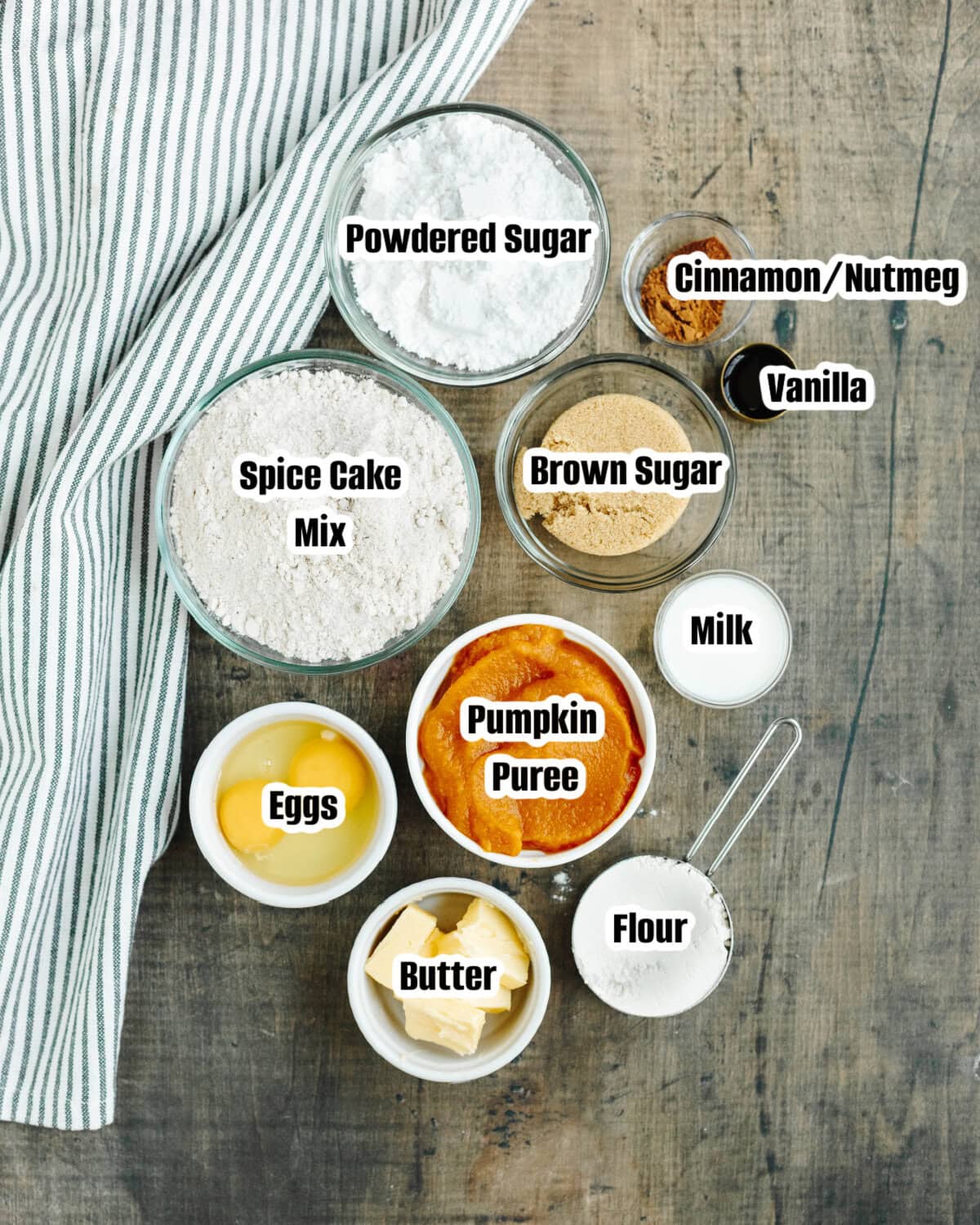 All the ingredients needed to make baked pumpkin spice donuts.