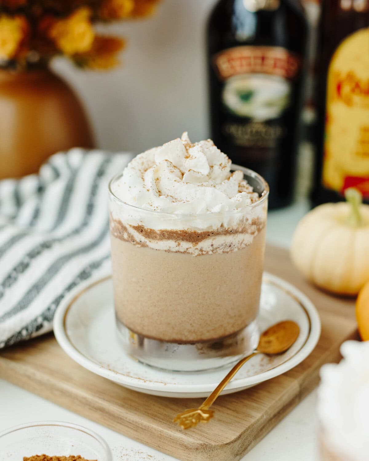 A pumpkin spice mudslide garnished with cinnamon and whipped cream ready to serve.