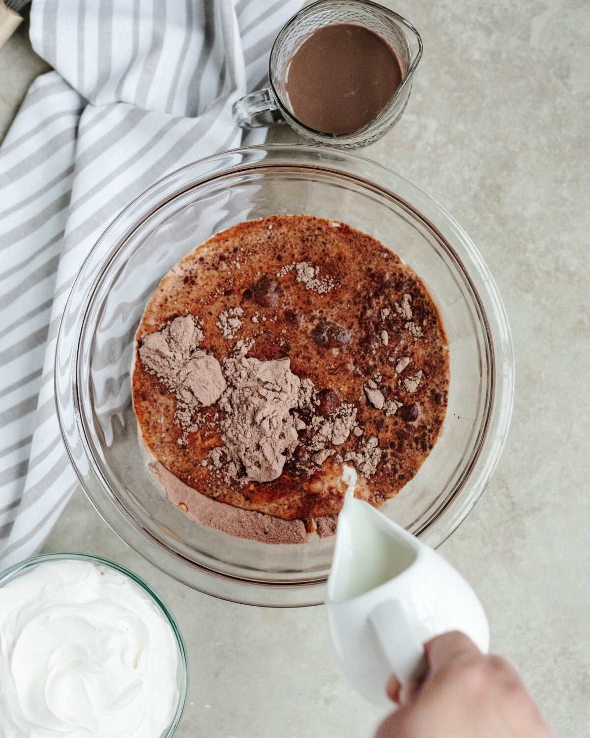 Milk poured into a chocolate pudding mixture.