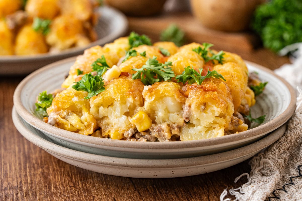 A serving of tater tot casserole on a white plate.