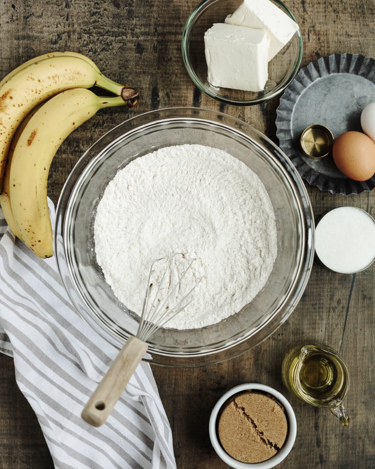 Flour, baking powder, baking soda, and salt combined in a bowl.