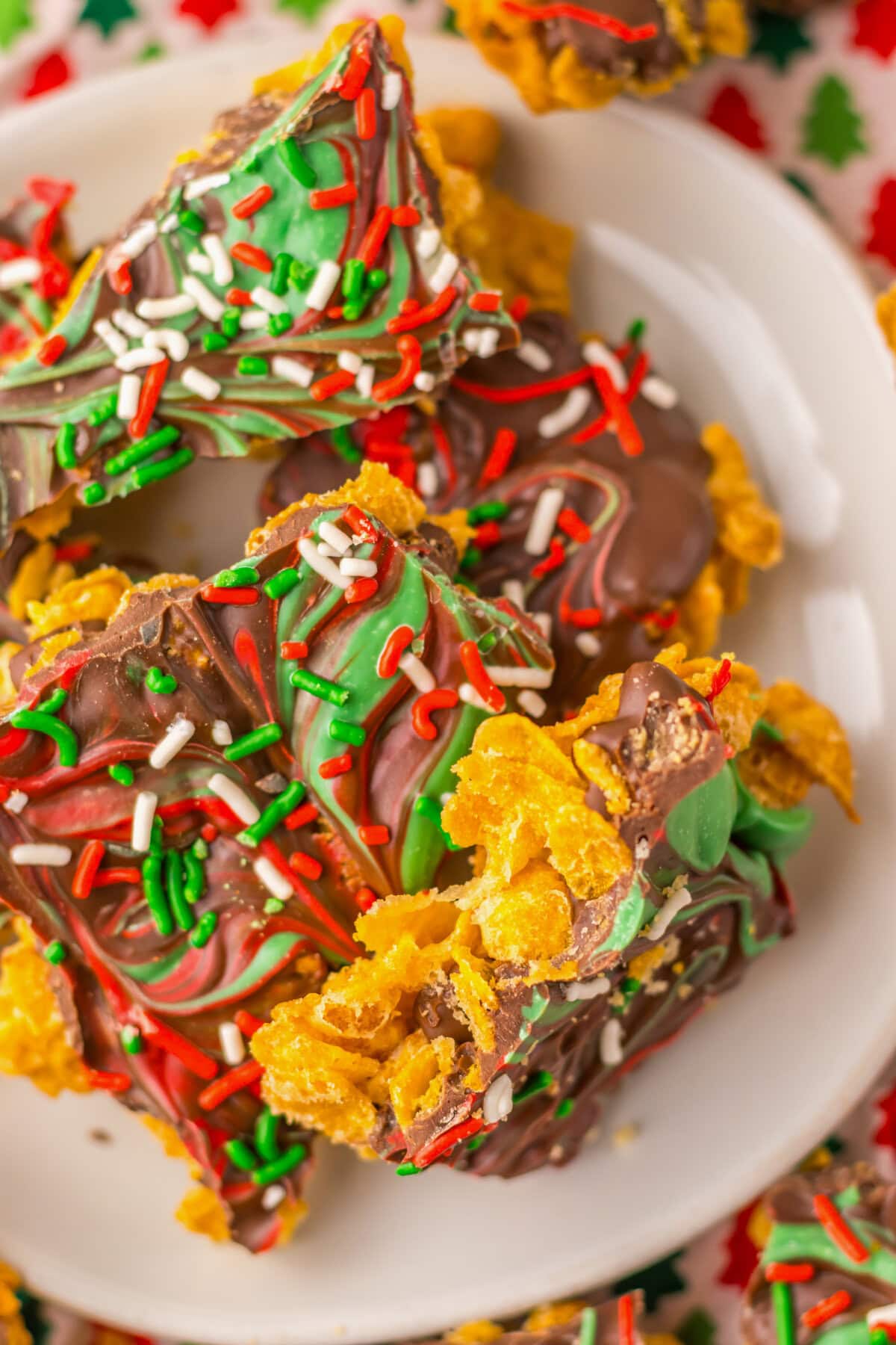 Pieces of cornflake brittle on a white serving plate.